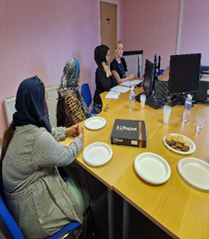Members of the PPG at a table for a meeting
